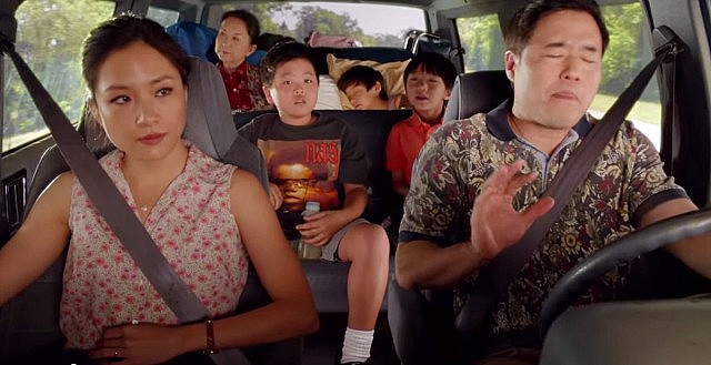 The Huang family in a car