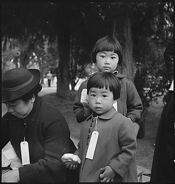 Mochida family children await a bus to an internment camp